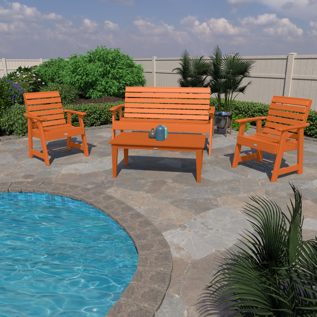 Orange 5ft Riverside bench, 2 chairs, and table by a pool