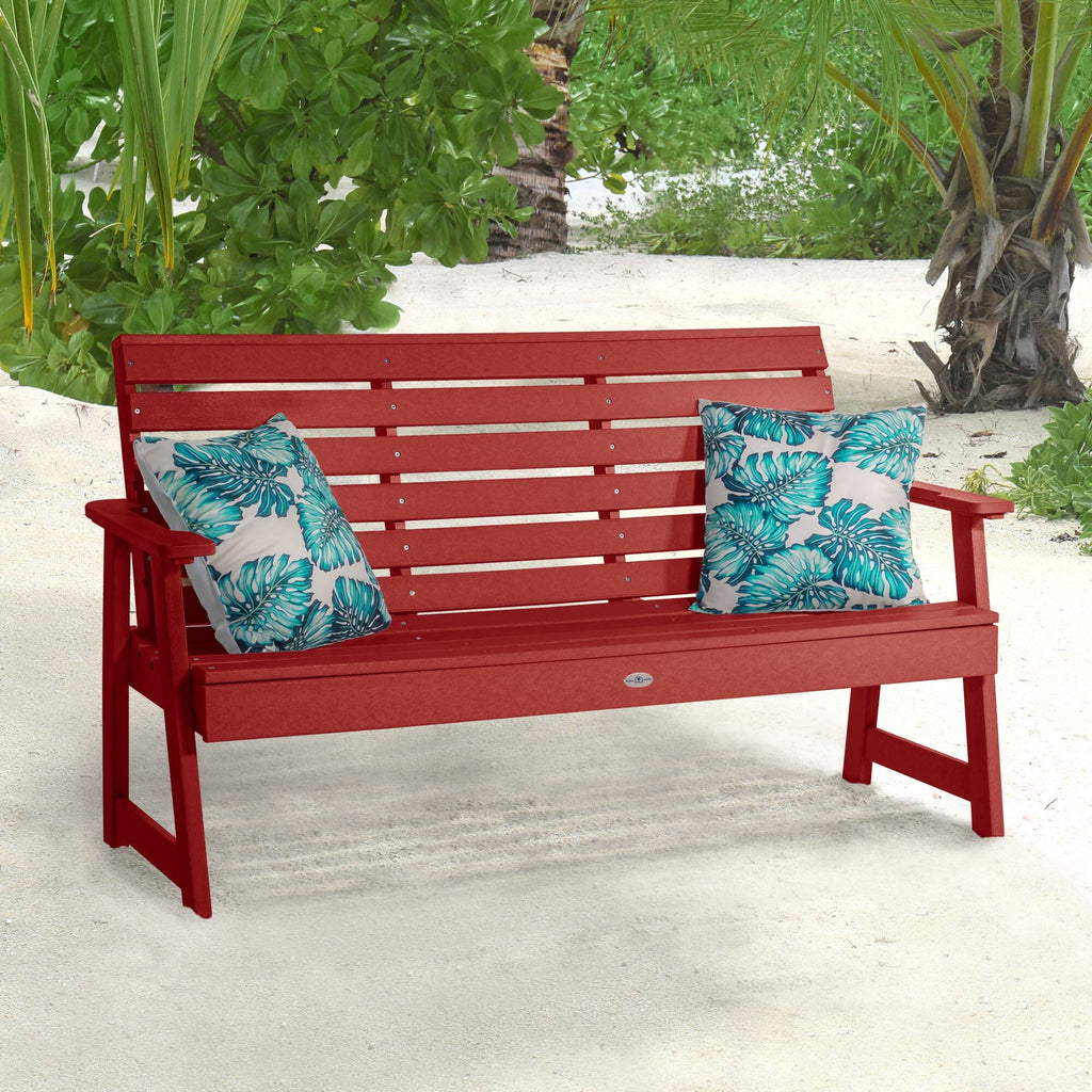 Red Riverside Garden bench on beach with pillows 