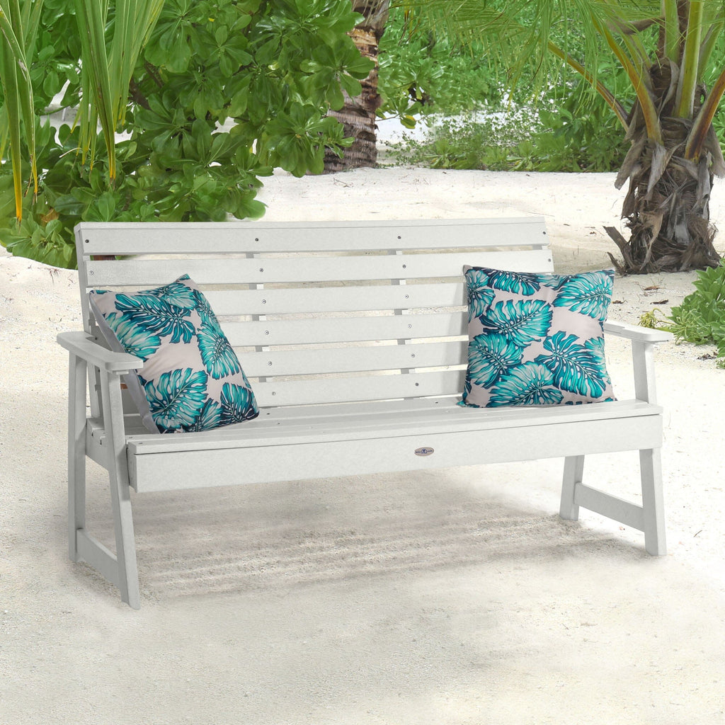 White Riverside Garden bench on beach with pillows 