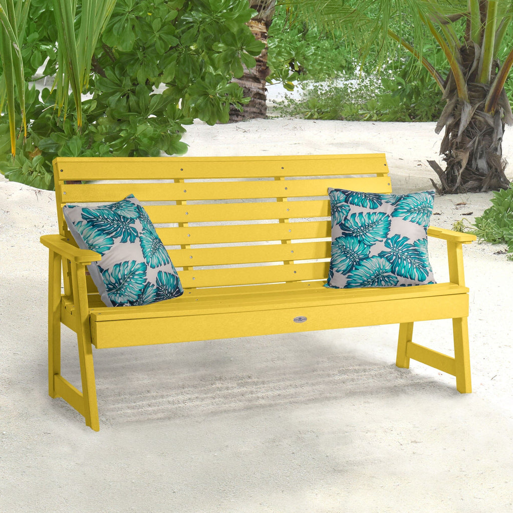 Yellow Riverside Garden bench on beach with pillows 