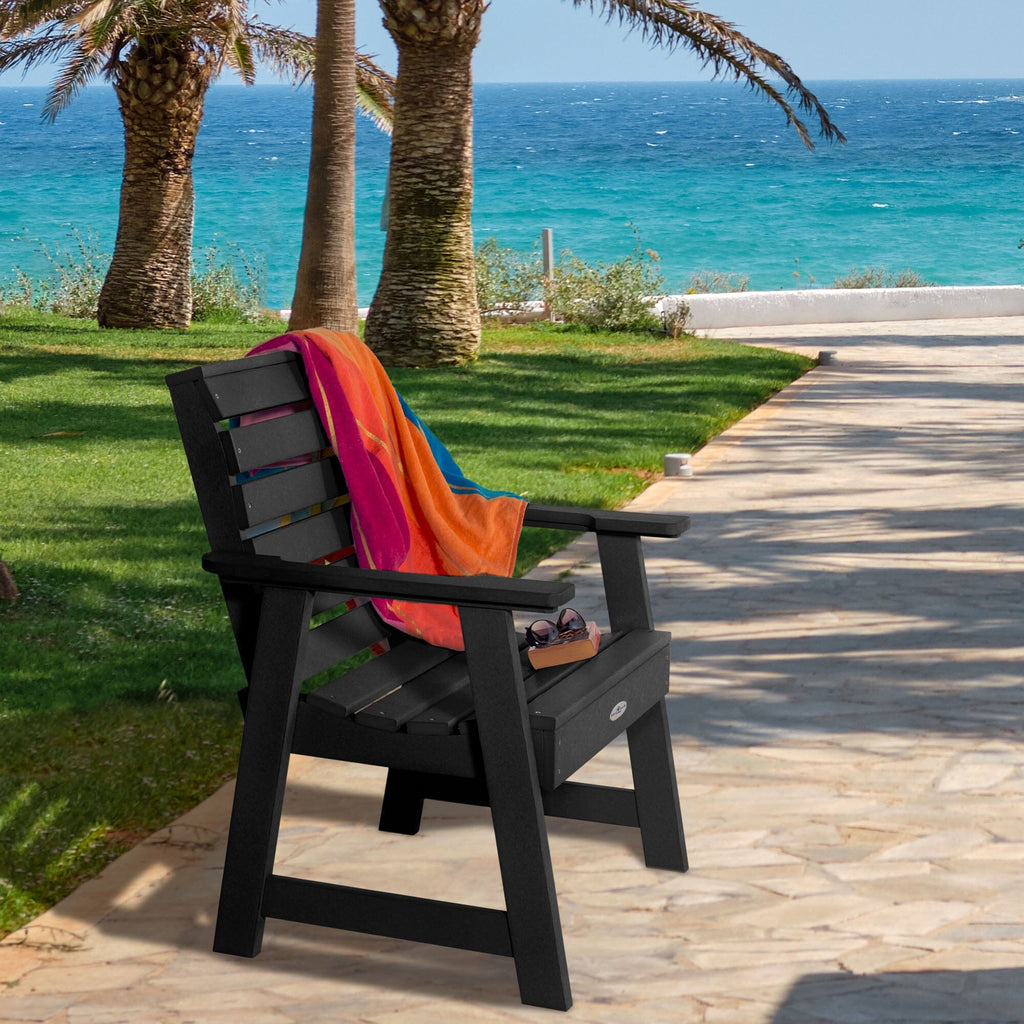 Black Riverside Garden chair with towel and sunglasses 