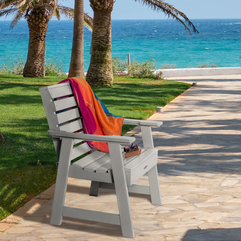 Gray Riverside Garden chair with towel and sunglasses 