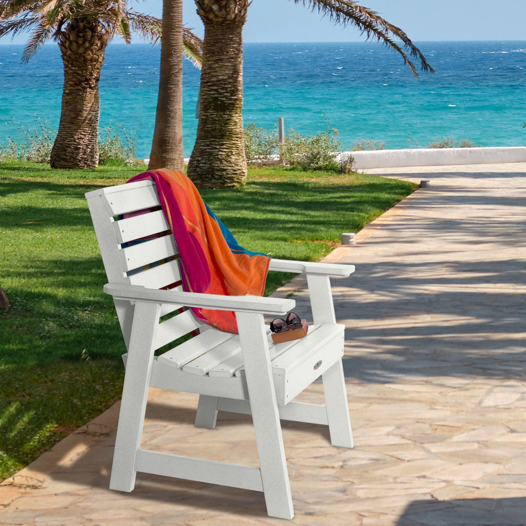 White Riverside Garden chair with towel and sunglasses 