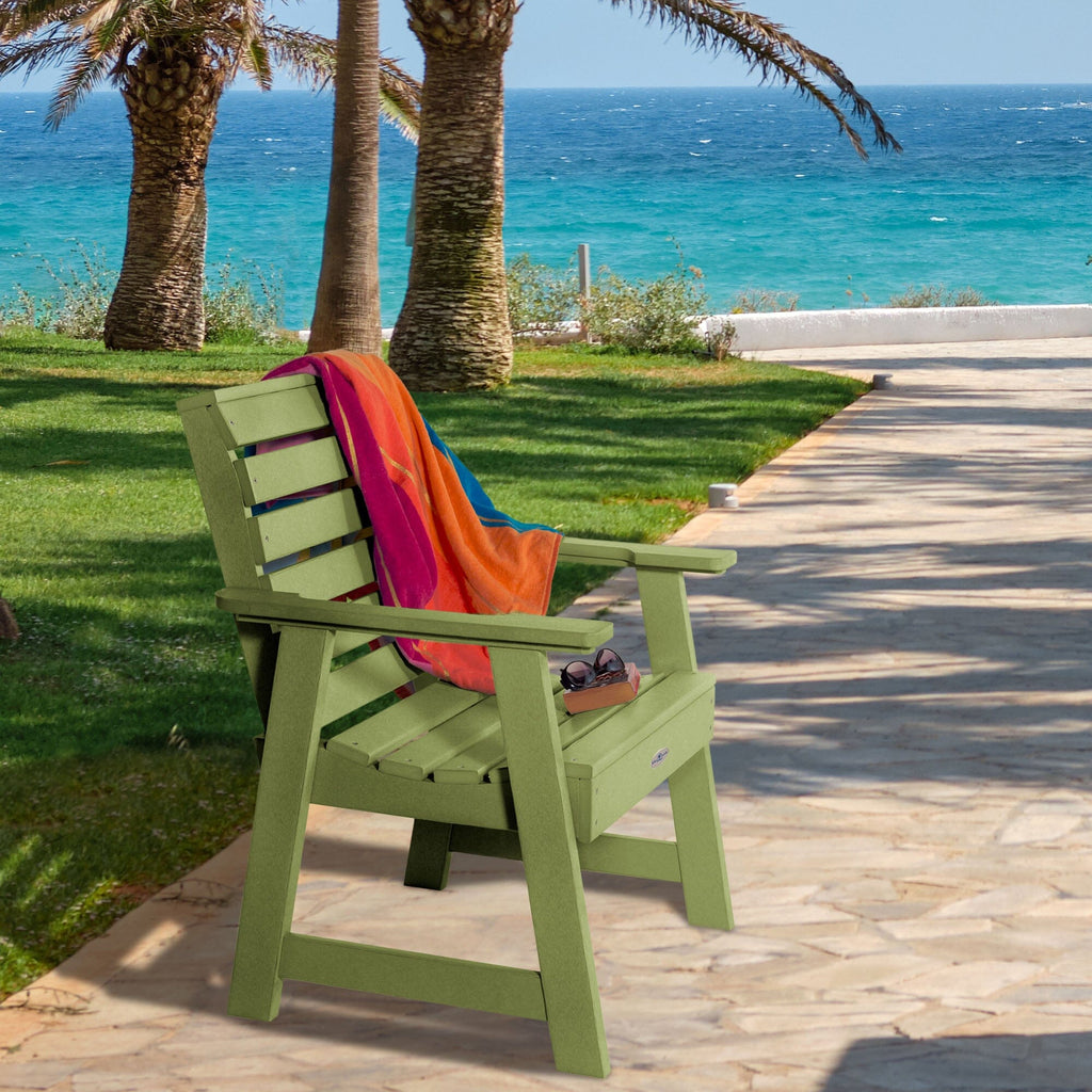 Green Riverside Garden chair with towel and sunglasses 