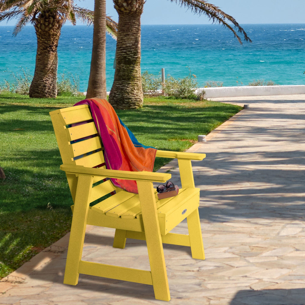 Yellow Riverside Garden chair with towel and sunglasses 