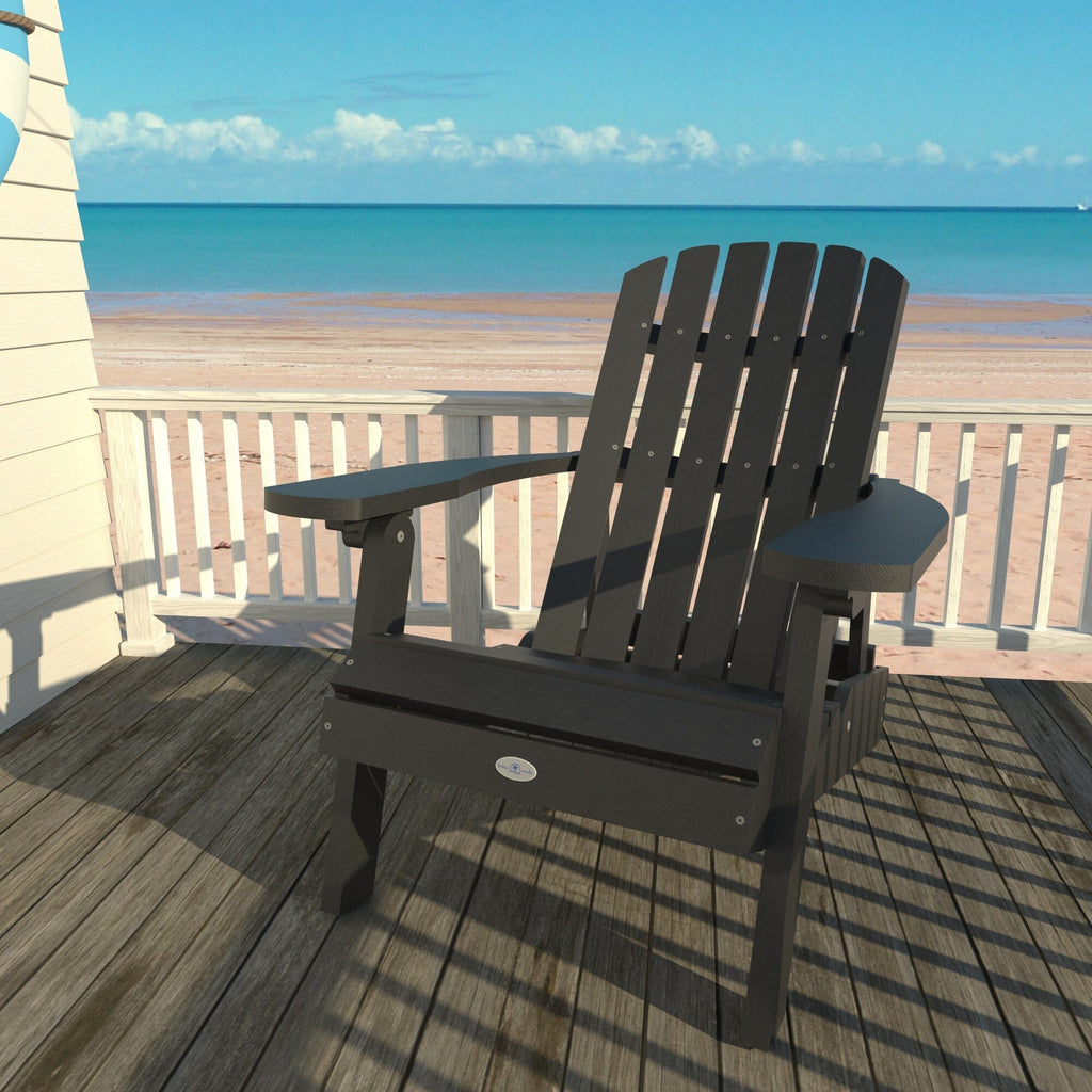Black Cape folding Adirondack chair on a deck overlooking the beach