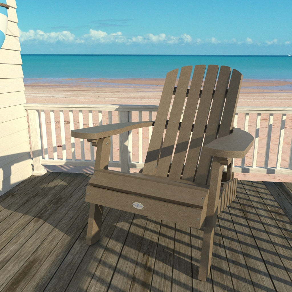 Tan Cape folding Adirondack chair on a deck overlooking the beach