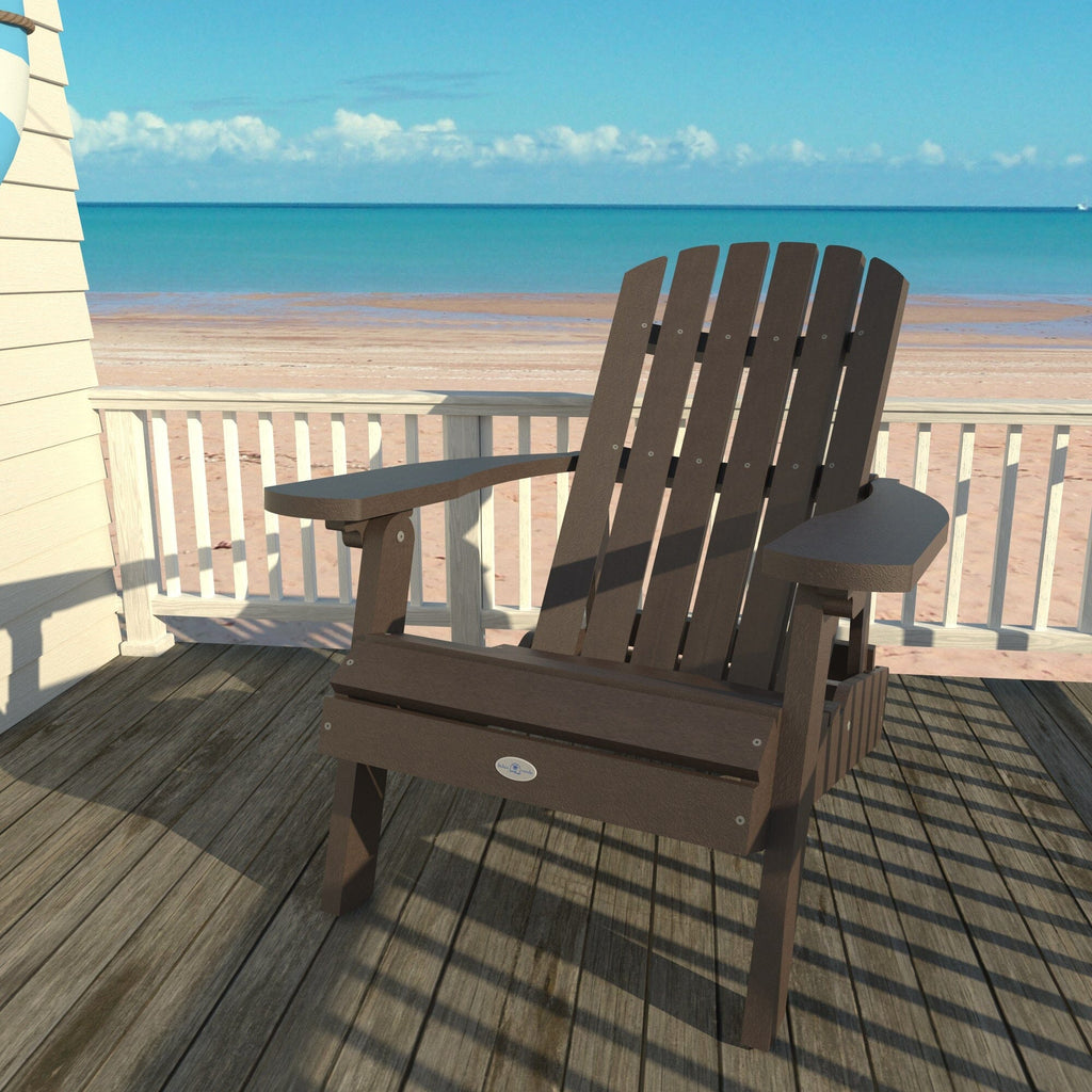 Brown Cape folding Adirondack chair on a deck overlooking the beach