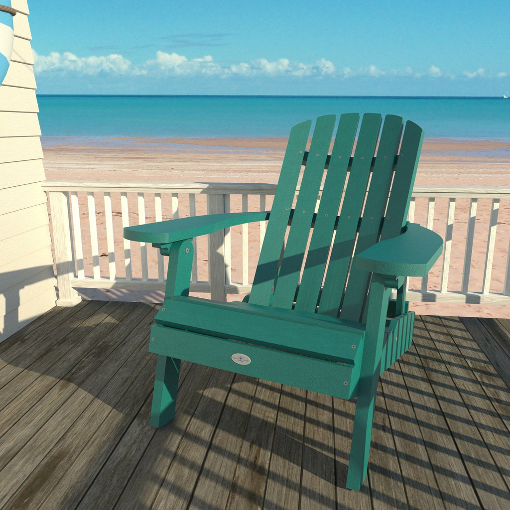 Blue Cape folding Adirondack chair on a deck overlooking the beach