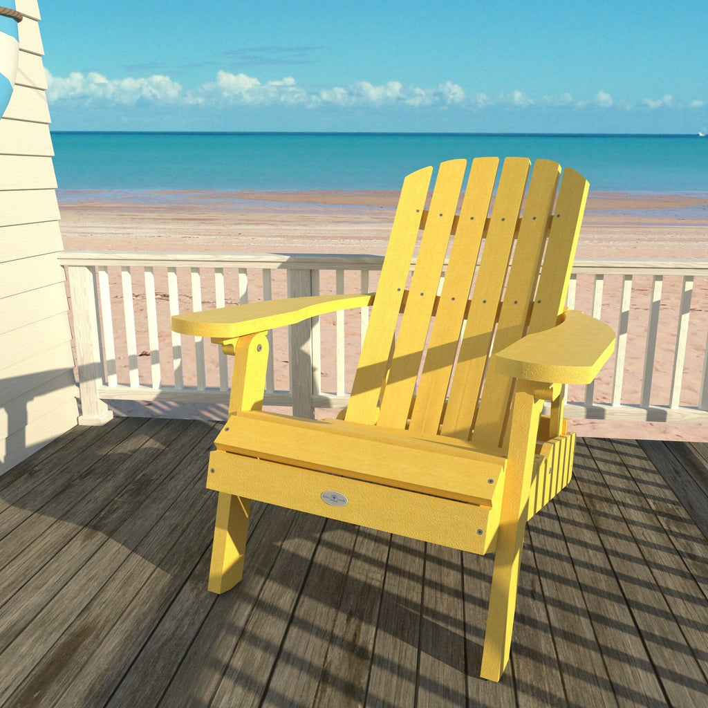 Yellow Cape folding Adirondack chair on a deck overlooking the beach