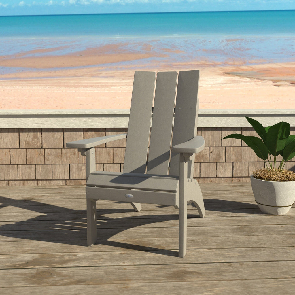 Gray Corolla Comfort Height Adirondack Chair with beach background