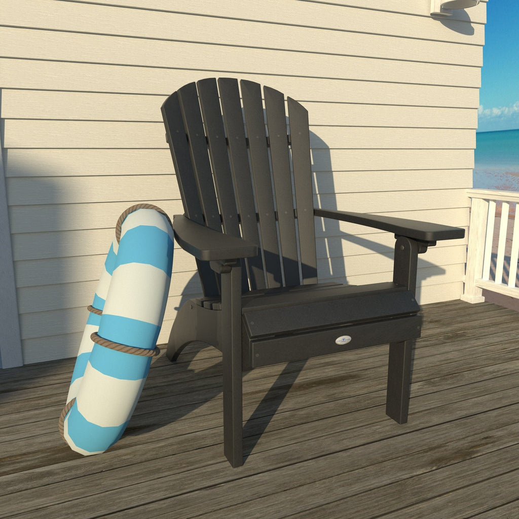 Black Waterfall comfort height Adirondack chair on a deck with a life ring