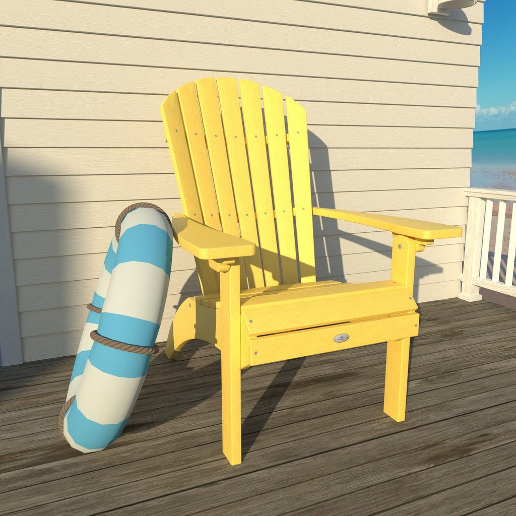 Yellow Waterfall comfort height Adirondack chair on a deck with a life ring