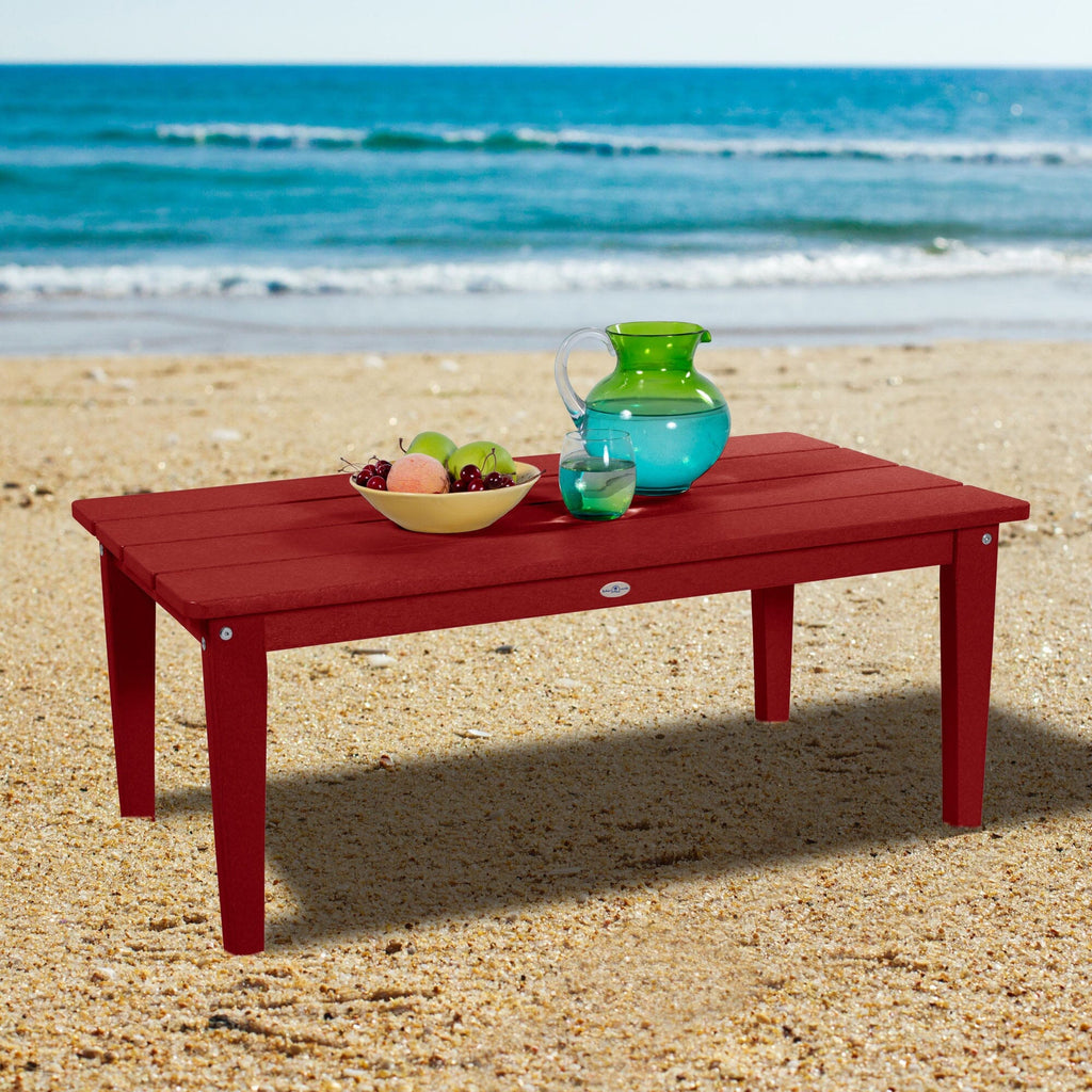 Red Adirondack Conversation table on a beach