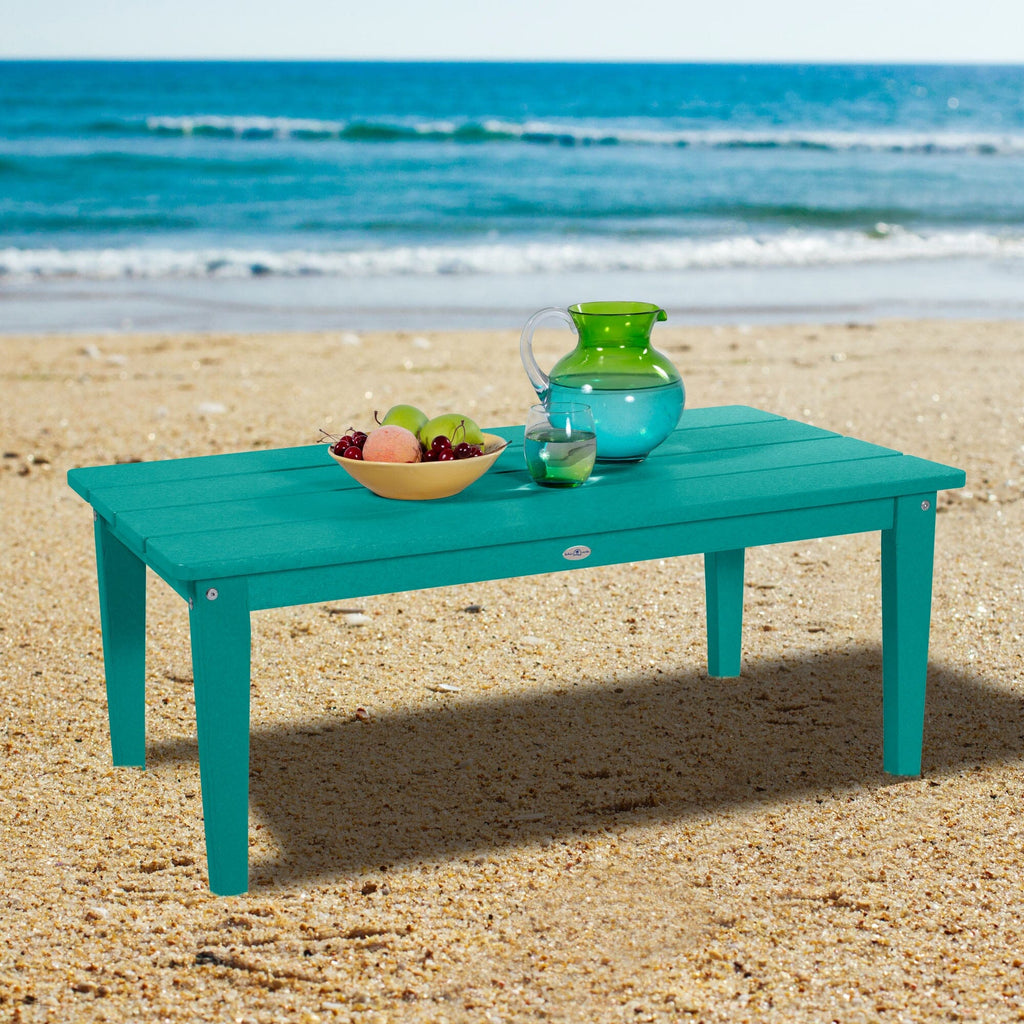 Blue Adirondack Conversation table on a beach