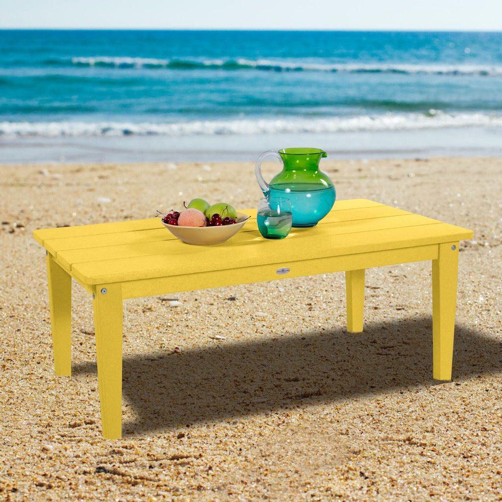 Yellow Adirondack Conversation table on a beach