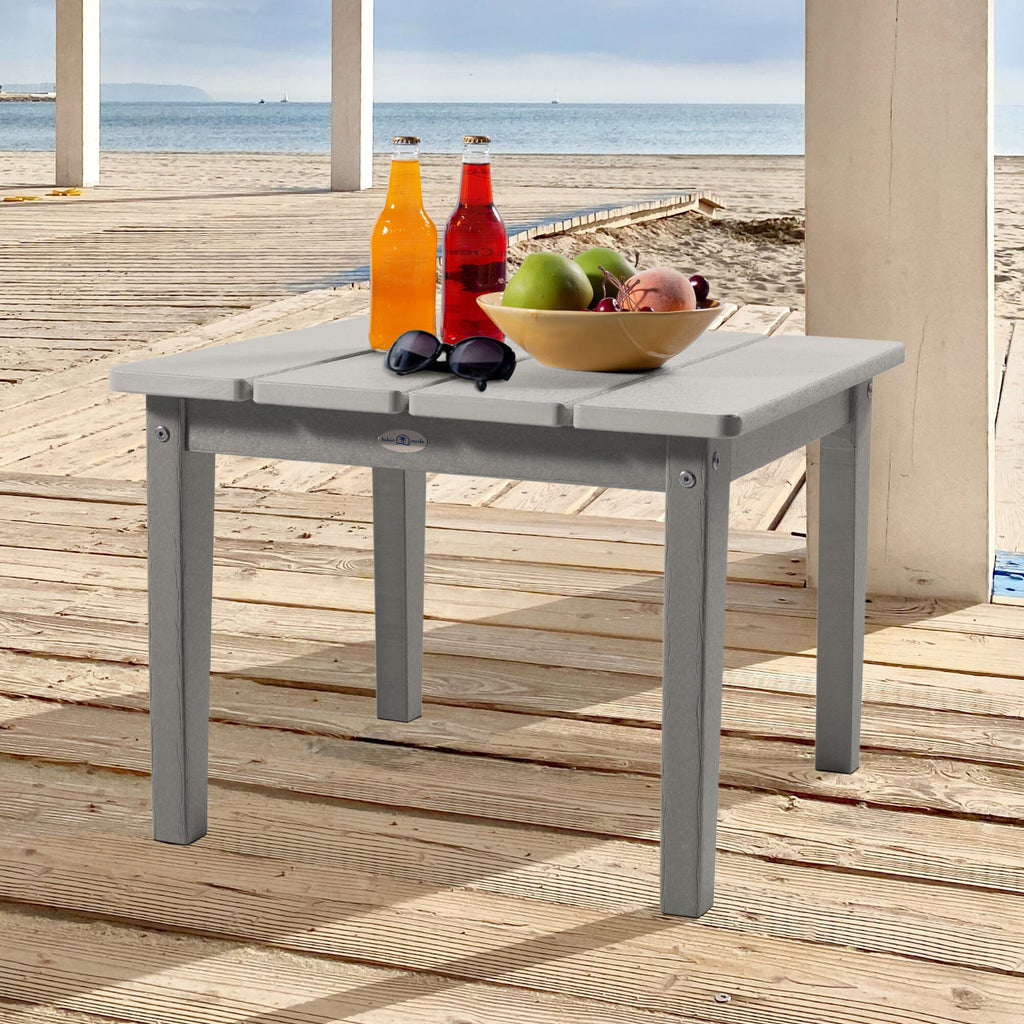 Large gray Adirondack side table with drinks, fruit, and sunglasses