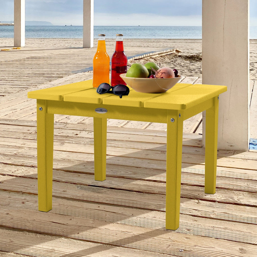 Large yellow Adirondack side table with drinks, fruit, and sunglasses
