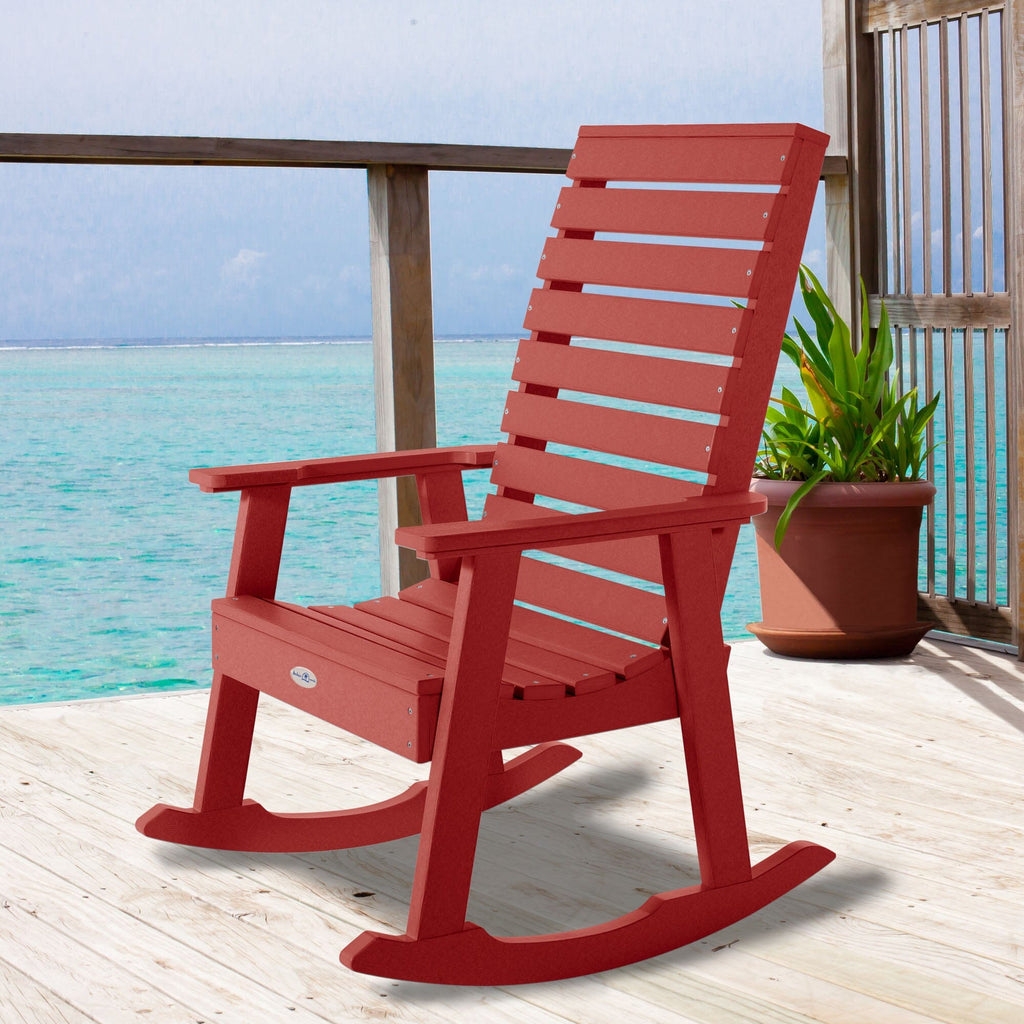 Red Riverside rocking chair on a deck overlooking water
