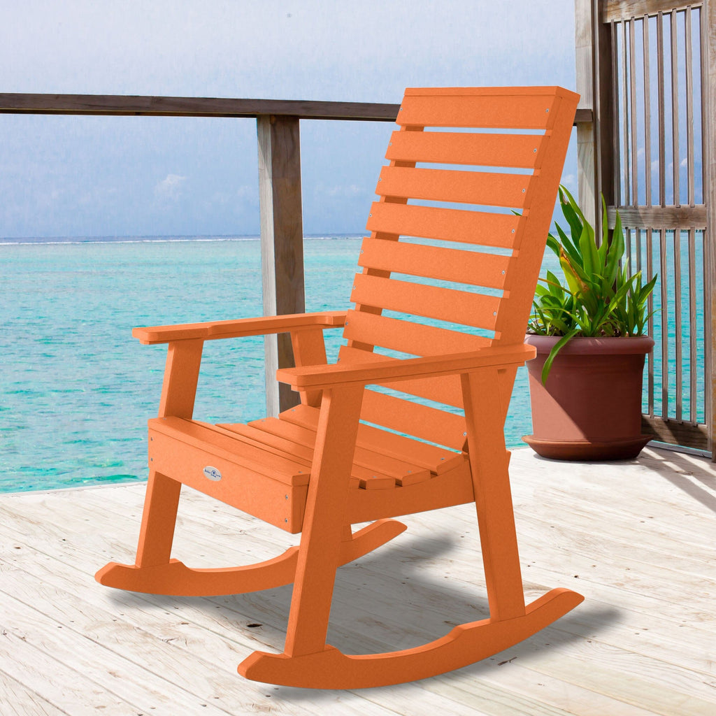 Orange Riverside rocking chair on a deck overlooking water