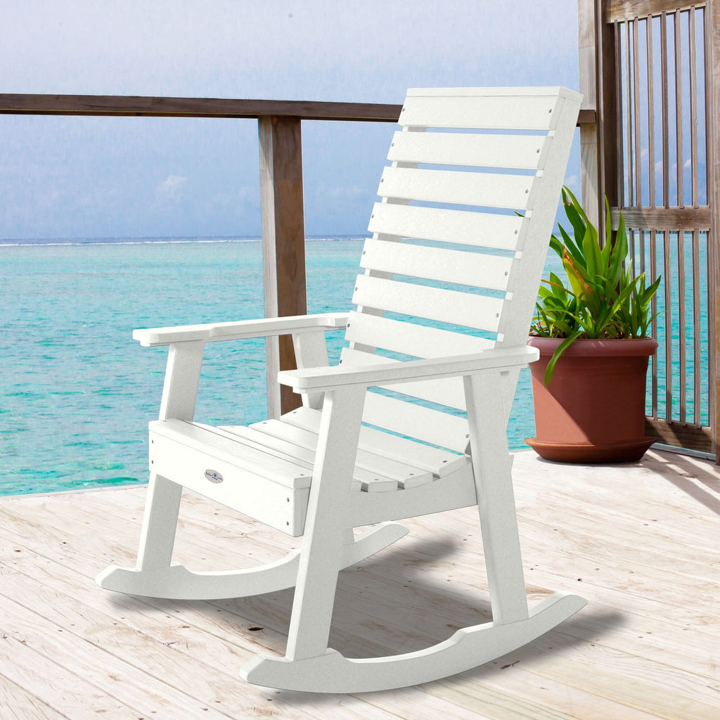White Riverside rocking chair on a deck overlooking water