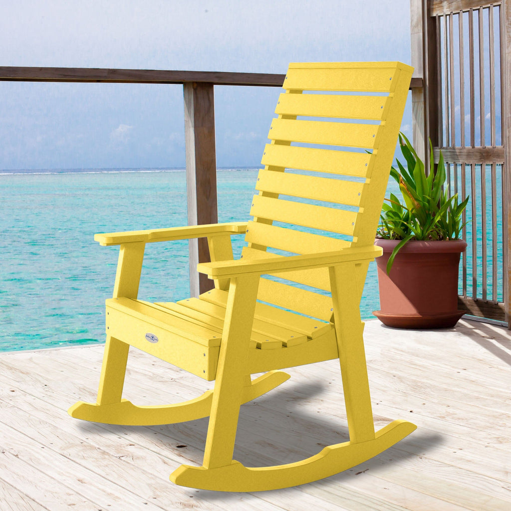 Yellow Riverside rocking chair on a deck overlooking water